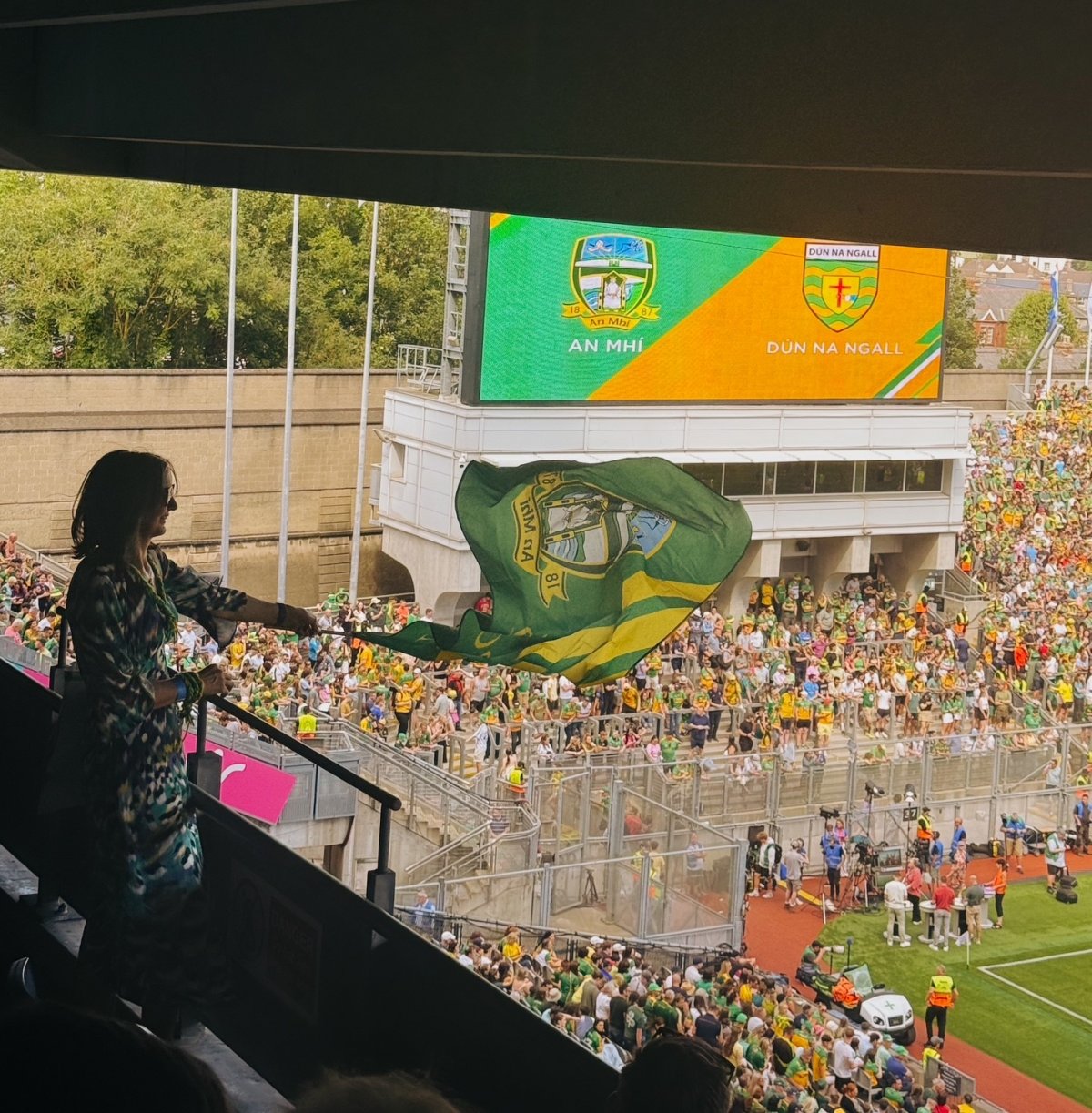 County Meath Chamber CEO Paula McCaul flying the Meath flag in Croke Park at Meath v Donegal - GAA Football All-Ireland Senior Championship Semi. Hosted by ESB.