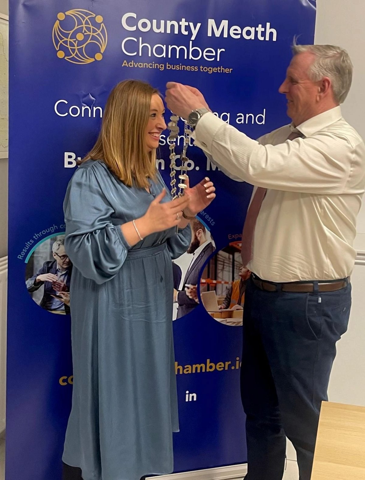Outgoing President Michael Hughes hands over the President Chain of Office to incoming President of County Meath Chamber Niamh Giffney